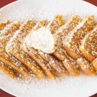 French Toast · Four slices of Texas toast served with powdered sugar and cinnamon.