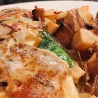 Farmers Omelet · Mushrooms, baby spinach, roasted red peppers, caramelized onions and mixed cheese. Served wi...
