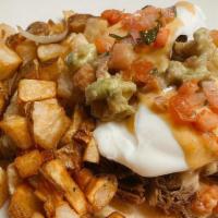 Barbacoa Benedict · Tender short ribs, corn tortillas, to poached eggs, chipotle hollandaise sauce, guacamole, a...