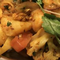 Aloo Gobi · Cauliflower, potato cooked with onion, tomatoes and spices.