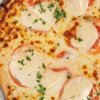 Margarita Pizza · Vine-Ripened Tomatoes, Basil, Homemade Mozzarella