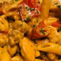 Chicken & Sausage Vodka · Sautéed Chicken Breast, Bianco Sausage, Peppers and Onions, in a Tomato Vodka Cream Sauce, T...