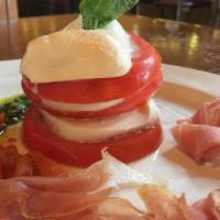 Caprese Salad · Thick sliced Tomato, Fresh Basil, Mozzarella Prosciutto for an additional cost