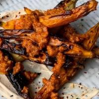 Roasted Carrots · muhammara, roasted red pepper, Aleppo, tahini yogurt. **contains nuts and gluten