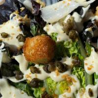 Caesar Salad · romaine lettuce, fried garlic, croutons, shaved parmesan. ***anchovy in dressing