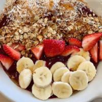 Rainbow Acai Bowl · Organic acai berries blended with blueberries, bananas, strawberries and almond milk. Topped...