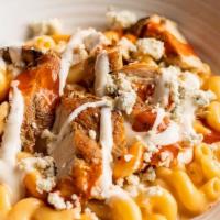 Spicy Buffalo Chicken Mac N' Cheese · Our house Vermont Cheddar mac n’ cheese tossed with our house-made hot sauce, marinated gril...