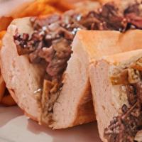 Not Your Average Cheesesteak · 9oz of thinly sliced rib-eye  with your choice of cheese & favorite toppings on a roll.