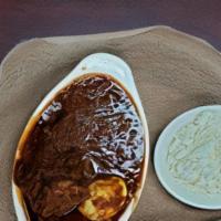Doro Wot (Spicy) · Spicy. Traditional dish, chicken simmered in berbere sauce and herbal butter served with inj...