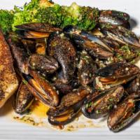 Mussels · With white wine garlic sauce.