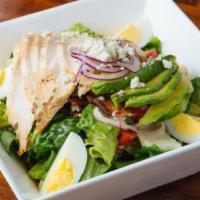 Cobb Salad · Romaine, avocado, grilled chicken, bacon, blue cheese, hard boiled egg, onion, tomato.