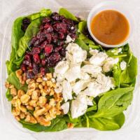 Baby Spinach · Baby spinach, goat cheese, walnuts, dried cranberries and balsamic vinaigrette dressing.