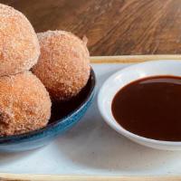 Bomboloni - Warm Ricotta Donut Holes · with Nutella Chocolate Sauce & Seasonal Fruit Compote