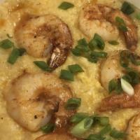 Spicy Shrimp & Grits · Seared shrimp with a sprinkling of cayenne and paprika,served over creamy, stone ground grits
