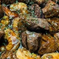 Filet Tips And Shrimp Family Dinner · Grilled Filet tip and shrimp served with veal Demi sauce and fingerling potatoes, roasted ca...