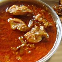 Chicken Curry · Tender chunks of chicken breast stewed in a seasoned sauce with chickpeas and spices.