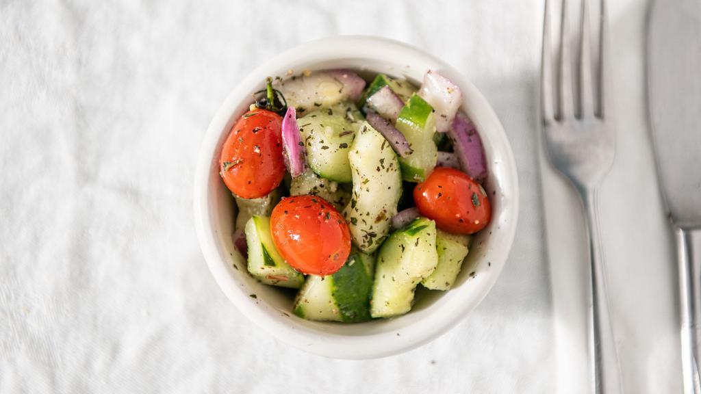 Cucumber Salad · Cucumbers, tomatoes, and onions in an herb vinaigrette.