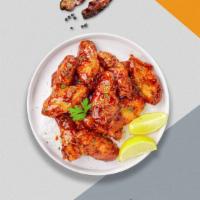 Sweet Blazing Bbq Wings · Fresh chicken wings breaded, fried until golden brown, and tossed in honey and barbecue sauc...