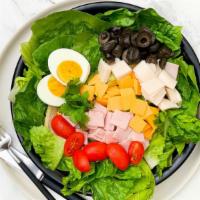 Chef Salad · Lettuce, tomato, turkey, ham, olive, green pepper, onion and mozzarella cheese.