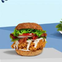 Call Me Cado Sandwich · Buttermilk fried chicken, sliced avocado, lettuce, tomatoes, ranch, and mayo served in a bri...