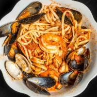 Linguini Alla Pescatore · Baby clams, little neck clams, calamari, mussels, scallops and shrimp served in a red or whi...