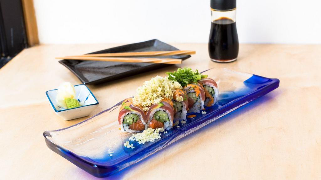 Hot Sea · Salmon and cucumbers topped with seared tuna, crunch, scallions and spicy mayo. Includes ginger and wasabi.