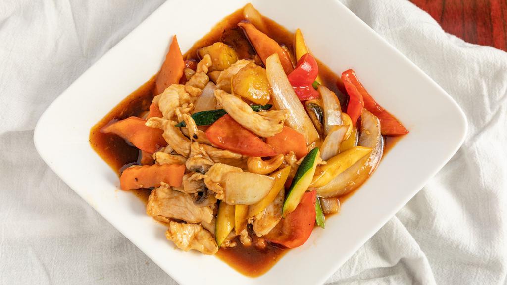 Chicken Tropical · Mild spicy. Sautéed of slices of chicken breast meat with roasted cashew nuts, red peppers, mushrooms, zucchini, pea pods, onions, summer squash, pineapples in our house mild spicy sauce.