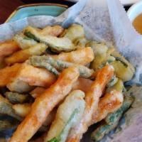 Thai Sticks · Served with peanut sauce. Deep fried yam, zucchini & string beans in a light batter.