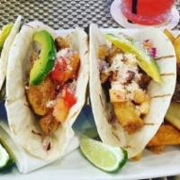 Fish Tacos (3) · Fried Atlantic Haddock, avocado, pineapple salsa, and queso fresco.