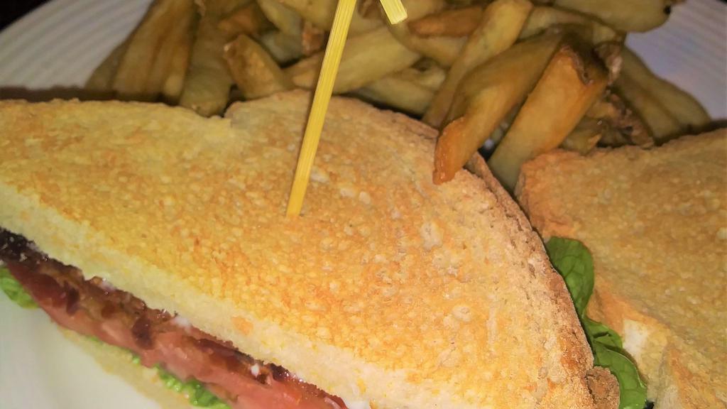 Village Blt · Applewood smoked bacon, lettuce, tomato, on white toasted bread. Served with Fries.