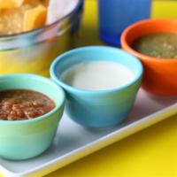 Salsa Bar + Chips · Hatch chili ranch, Surfside Salsa and Tomatillo salsa. Comes with housemade chips.