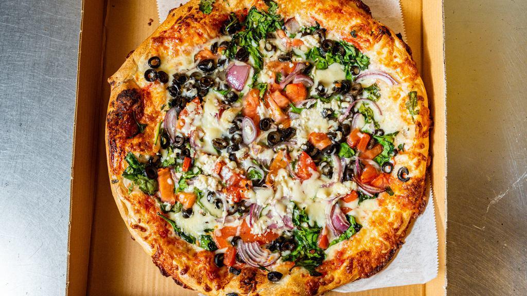 Greek Pizza · Feta cheese, spinach, garlic, onions, tomatoes, olives and mozzarella.
