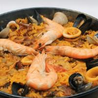 Paella  De Marisco · Saffron rice stew made with mussels, cockle clams, calamari, and shrimp in a lobster and shr...