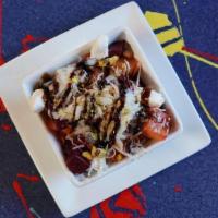 Ensalada De Remolacha · Beets, pistachio, goat, and manchego cheese salad with sherry glaze dressing.