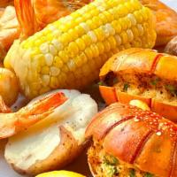 Lobster Tails Combo · 2 Lobster Tails (approx. 4 oz), Shrimp (1/2 lb), 
choice of 2 sides.