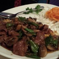 Mongolian Lamb · Scallion, mushrooms and snow peas in a Mongolian barbeque sauce. Served with white rice.