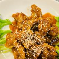 Sesame Chicken · Crispy morels of chicken sauteed in a semi sweet sesame sauce with broccoli and served over ...