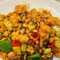 Kung Pao Chicken · Diced chicken with red and green peppers, celery, water chestnuts and peanuts. Served with w...