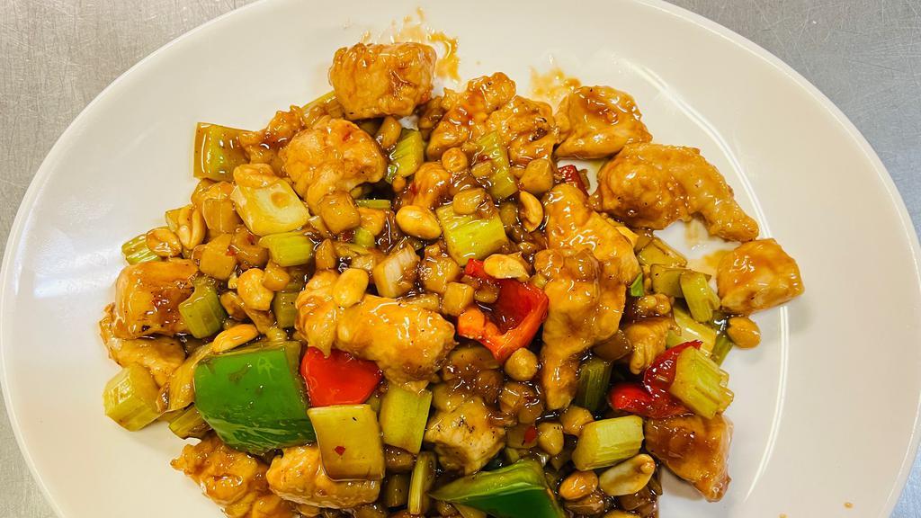 Kung Pao Chicken · Diced chicken with red and green peppers, celery, water chestnuts and peanuts. Served with white rice.