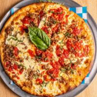 Nona’S Pizza · Thin crust pan pizza with chunky tomato sauce, fresh mozzarella, sausage and fresh basil