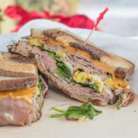 Roast Beef & Horseradish · Roast beef, horseradish, mayo, cheddar, spinach, onions, and hot peppers on swirl bread.