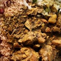 Curry Chicken · Served with rice and peas and cabbage or white rice.