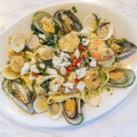 Seafood Supreme · Sautéed shrimp, scallops, clams, mussels, lump crab meat, spinach and roasted peppers, garli...