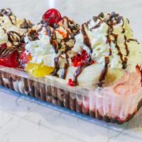 Banana Split · Three Flavors of Ice Cream, Fresh Banana, One Topping. Additional Toppings $1.00 each