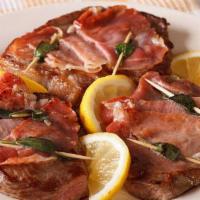 Veal Saltimbocca · Vealt cooked in a white wine sauce with sage, prosciutto, and melted mozzarella cheese.