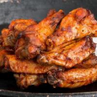Wings · Seasoned with our house rub, then hickory smoked for hours and tossed in your choice of sauc...