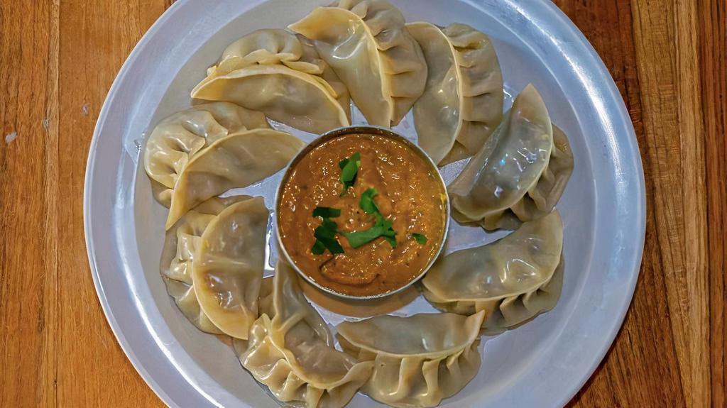 Chicken Momos · Classic dumplings steamed or pan-seared. Served with our secret momo sauce.
