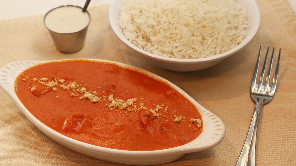 Chicken Makhni · Also known as butter chicken. Creamy tomato curry and cashew paste with boneless chicken.
