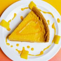 Mango Cheesecake · Baked in house. Light and tangy cheesecake with a crunchy Graham cracker crust.