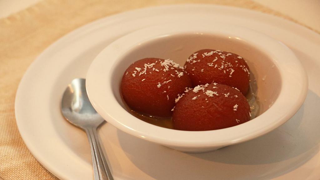 Gulab Jamun · Two fried little balls of joy. Soaked in a sweet honey syrup.